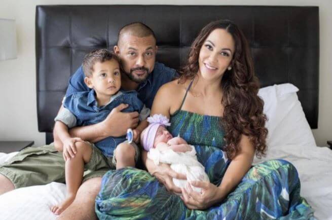 Frances Henriques's son, Sean Paul, with his wife, Jodi Stewart, and daughter and son.